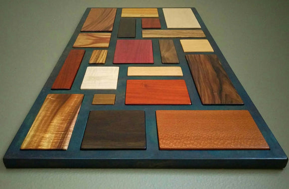 Multicolored wood mosaic, with black steel lattice separating each type.