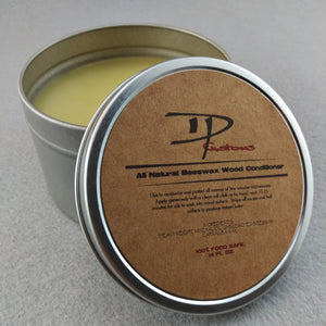 Open metal tin of DPCustoms beeswax wood conditioner