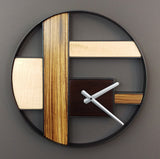 Round black metal frame wall clock with irregular grid of Zebrawood and Figured maple