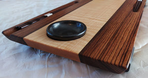 Long 2 person wooden sushi board. center wood is figured maple with zebrawood sides. chopstick grooves in zebrawood, and inset black ceramic sauce dishes on ends