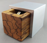 Cube shaped engagement ring box, silver aluminum shell with black streaked marblewood insert