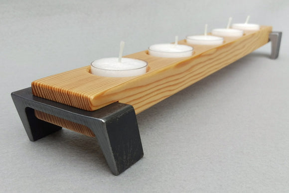 Light toned wood tea light candle holder, 5 candle capacity, dark black angled legs on either end