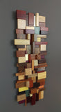 Small multi colored wood and metal mosaic, made with a variety of exotic woods