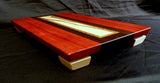 Red white and brown wooden cutting board. center is ambrosia maple with dark streaks.
