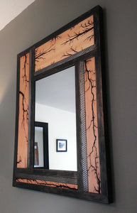 Dark metal frame wall mirror, pinwheel wood tiles have lichtenberg figures burnt in, stainless steel accents