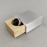 silver metal engagement ring box with maple insert