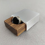 silver metal engagement ring box with walnut insert